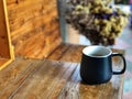 Best time to relax,Black coffee cup on the wooden table in the morning