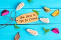 The best is yet to come text on paper tag