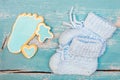 Best whishes for the newborn baby boy, blue cookies and shoes on Royalty Free Stock Photo