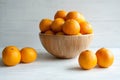 Plain orange mandarins on a grey background