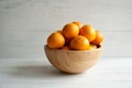 Plain orange mandarins on a grey background