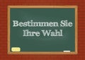 Bestimmen Sie Ihre Wahl - Determine your choice in German blackboard notice Royalty Free Stock Photo