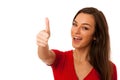 Besutiful business woman gesturing success with showing thumb up