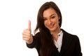 Besutiful business woman gesturing success with showing thumb up
