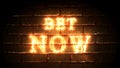 Bet Now glowing fiery inscription on brick wall background. Betting concept. Fire. 3D render.