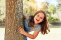 Bet you didnt see me hiding here. Portrait of a little girl playing at the park. Royalty Free Stock Photo