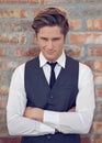 Bet you wish you knew what Im planning...a well-dressed young man looking smug. Royalty Free Stock Photo