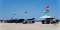 Bethany Beach, Delaware, U.S - July 8, 2023 - The view on the drive-in and trucks parked on the surf fishing beach in the summer