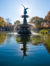 Bethesda Fountain against sun with angel statue reflecting in th Royalty Free Stock Photo