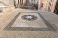 Decorative mosaic star laid out on the floor in the courtyard of the St. Marys Syriac Orthodox Church in Bethlehem in the