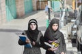 Bethlehem, Palestine. Female students walking down the street in national dress