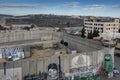 Bethlehem, Palestinian Authority, January 28, 2020: A high wall covered with grafitti separating the Palestinian Authority from