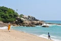 Bethsaida, Kerala, India, March, 05, 2019. The boy running along the store of Indian ocean to his mother