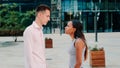 Betrayed black woman pushing her boyfriend after quarrel in the street Royalty Free Stock Photo