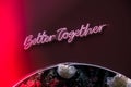 BETTER TOGETHER inscription in neon lights at night. Electric sign at night nightlife concept. Modern fluorescent life
