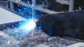 The better way to weld. Hand in glove hold welding steel. Welds with argon-arc welding.