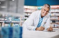 Bettering lives makes me feel good. a male pharmacist writing on a clipboard in a drugstore.