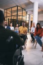 Bettering their businesses with a workshop. a group of businesspeople attending a conference at work.