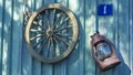 Betty lamp and spinning wheel in the background of the old log-house wall with sign nomber one. Rural retro still life. Royalty Free Stock Photo