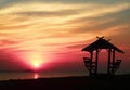 Beuatiful sunset background with a little hut