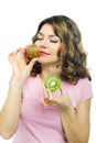 Beuatiful young girl smelling kiwi isolated on white Royalty Free Stock Photo