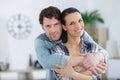 beutiful couple hugging at home