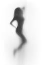 Beutiful dancer woman silhouette behind a curtain