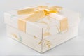 Beutiful gift box with flowers and golden ribbon