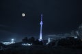 Beutiful landscape of clouds and moon over The Television Tower in Baku at night