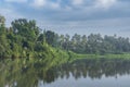 A beutiful scenery of landscape with river, sky in village in kerala, india Royalty Free Stock Photo