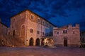 Bevagna, Perugia, Umbria, Italy: night view of the ancient main square with the medieval church and the Palazzo dei Consoli Royalty Free Stock Photo