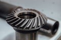Bevel gear on the shaft, close up view Royalty Free Stock Photo