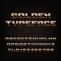 Beveled golden alphabet font. Metallic effect letters, numbers and symbols. Royalty Free Stock Photo