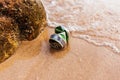Beverage Can on the beach and water flow Royalty Free Stock Photo