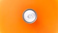 The beverage can's top and tab are visible, creating strong contrast with the orange background. Royalty Free Stock Photo