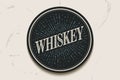 Beverage coaster with inscription Whiskey and light rays