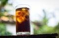 Beverage from cola in glass with ice on the brown wood,beverage in summer is sparkling water Royalty Free Stock Photo