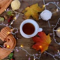 beverage, hot drink in a mug, leaves, foliage, garland, candles, top view of wooden table, concept happy Thanksgiving, good Royalty Free Stock Photo