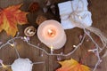 Beverage, hot drink in a mug, leaves, foliage, garland, candles, top view of wooden table, good weather concept, outdoor tea party Royalty Free Stock Photo