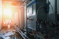 Beverage industrial factory with automated machine equipment in sun light Royalty Free Stock Photo