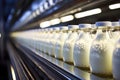 Beverage manufacturing: conveyor line at work, filling and packaging milk containers