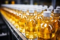 Beverage production line filling glass bottles with refreshing apple and pineapple juice Royalty Free Stock Photo