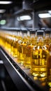 Beverage production line filling glass bottles with refreshing apple and pineapple juice