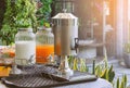 Beverages Juice Dispensers of milk, orange juice and drinking water for self service breakfast Royalty Free Stock Photo