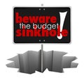 Beware the Budget Sinkhole Sign Hole Money Trouble Bankruptcy Royalty Free Stock Photo