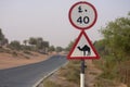 Beware of Came; crossing sign in a desert road or street in the United Arab Emirates Royalty Free Stock Photo