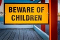 Beware of children yellow road sign