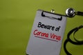 Beware of Corona Virus write on a paperwork isolated on Office Desk. Mysterious Viral Pneumonia in Wuhan, China. Healthcare/