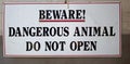 Beware dangerous animal do not open sign