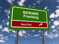 beware fracking next exit traffic sign on blue sky Royalty Free Stock Photo